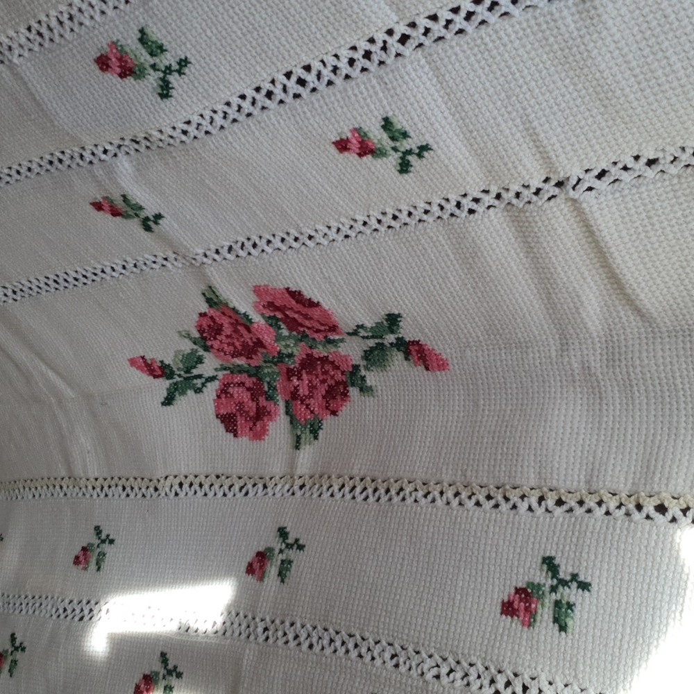 Vintage hand knit afghan with roses